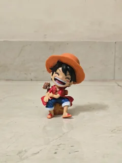 One Piece Monkey D. Luffy Sitting Figure – Red Cardigan Chibi Statue with Little Monkey
